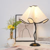 black metal table lamp with white linen shade for bedside and office
