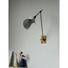 brass swing arm wall lamp with aluminum shade for bedroom and reading nook