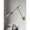 brass swing arm wall lamp with aluminum shade for bedroom and reading nook