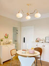 cream glass persimmon chandelier gold wood dining room