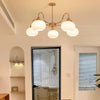 cream glass persimmon chandelier gold wood dining room