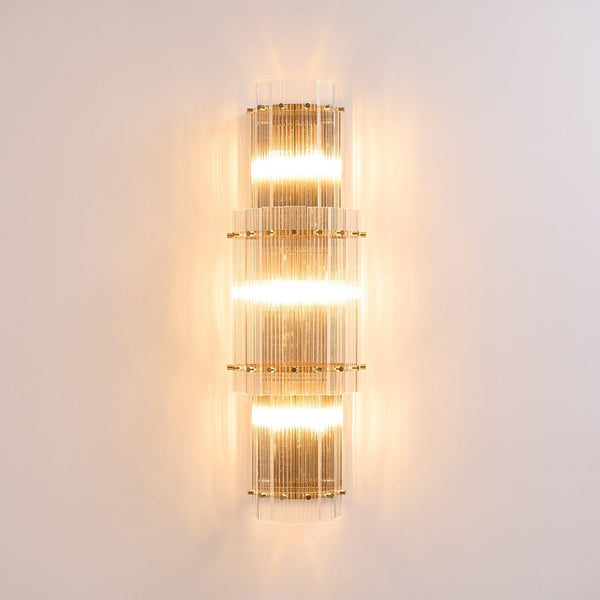 modern brass clear glass rod wall light