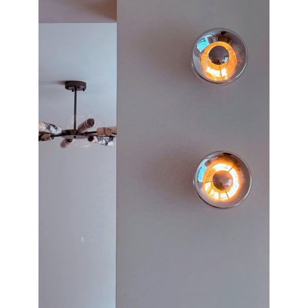 modern chrome glass void surface sconce