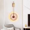 modern gold travertine disc led wall sconce