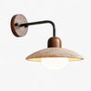 modern travertine disc wall sconce black gold
