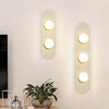 modern yellow travertine glass globe wall sconce 4