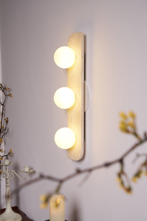 modern yellow travertine glass globe wall sconce