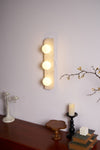 modern yellow travertine glass globe wall sconce