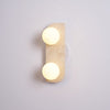 modern yellow travertine glass globe wall sconce