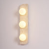 modern yellow travertine glass globe wall sconce