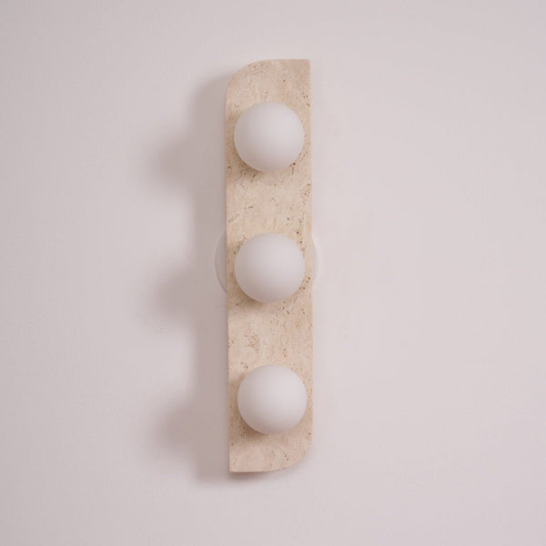 modern yellow travertine glass globe wall sconce