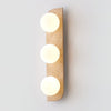 modern yellow travertine glass globe wall sconce