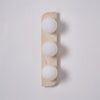 modern yellow travertine glass globe wall sconce