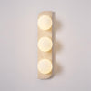 modern yellow travertine glass globe wall sconce
