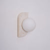 modern yellow travertine glass globe wall sconce