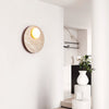 modern yellow travertine glass orb wall sconce