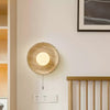 modern yellow travertine lunar eclipse wall sconce