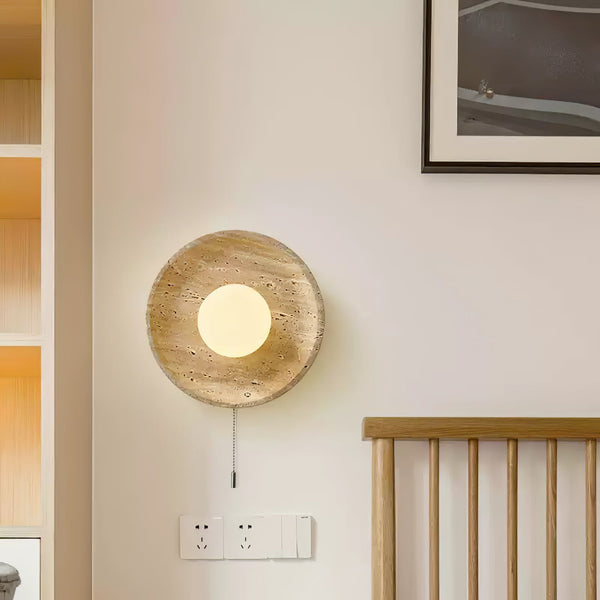 modern yellow travertine lunar eclipse wall sconce