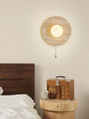 modern yellow travertine lunar eclipse wall sconce