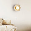 modern yellow travertine lunar eclipse wall sconce