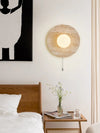 modern yellow travertine lunar eclipse wall sconce