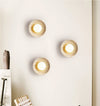 modern yellow travertine lunar eclipse wall sconce