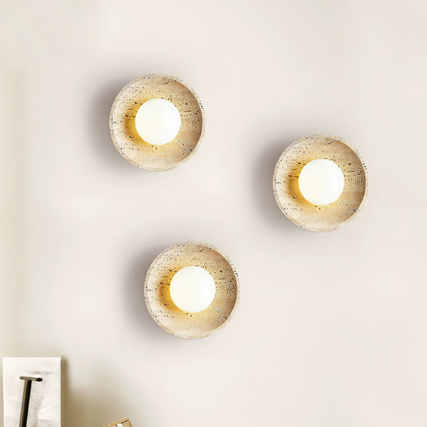 modern yellow travertine lunar eclipse wall sconce
