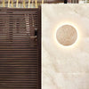 modern yellow travertine round led wall sconce