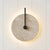 wabi sabi travertine disc wall sconce matte black