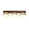 wabi sabi travertine walnut globe wall sconce
