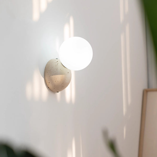 wabi sabi yellow travertine glass globe wall lamp