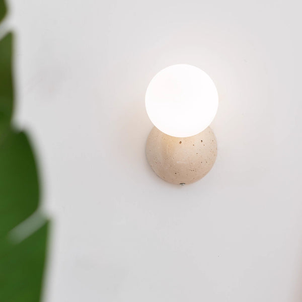 wabi sabi yellow travertine glass globe wall lamp