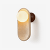 yellow travertine arch glass globe wall sconce