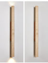 yellow travertine column wall sconce with dark walnut wood