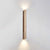 yellow travertine column wall sconce with dark walnut wood