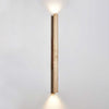 yellow travertine column wall sconce with dark walnut wood