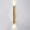 yellow travertine column wall sconce with dark walnut wood