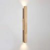 yellow travertine column wall sconce with dark walnut wood