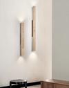 yellow travertine column wall sconce with dark walnut wood