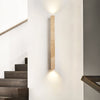 yellow travertine column wall sconce with dark walnut wood