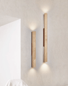 yellow travertine column wall sconce with dark walnut wood