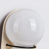 yellow travertine double globe wall sconce