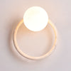 yellow travertine opaline glass globe wall sconce