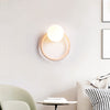 yellow travertine opaline glass globe wall sconce