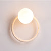 yellow travertine opaline glass globe wall sconce